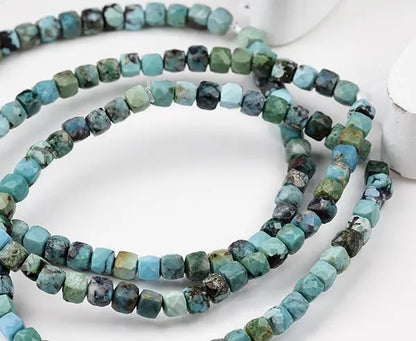 Türkis stab. Armband facettierte Würfel