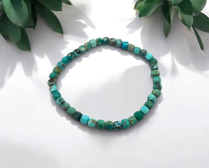 Türkis stab. Armband facettierte Würfel
